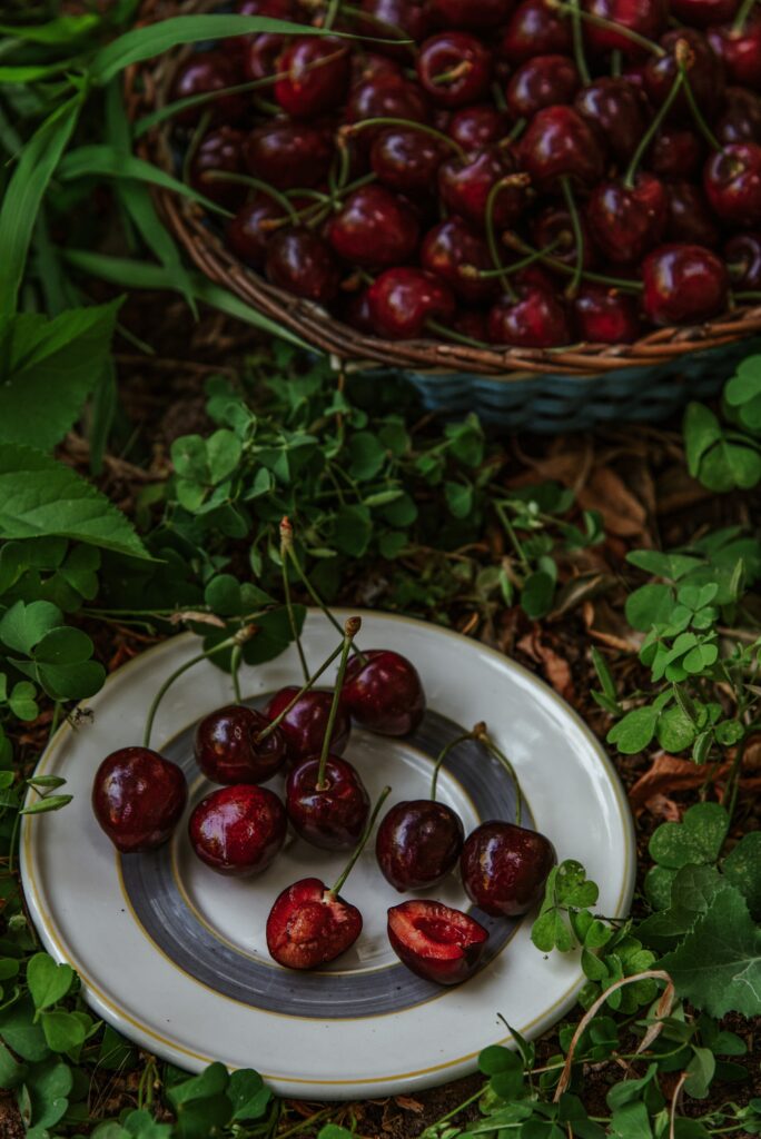 Vibrant Cherry Wallpaper: Fresh Red Cherries on White Plate
