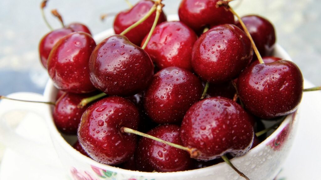 Vibrant Cherry Wallpaper: Juicy Ripe Cherries on a Fresh Background