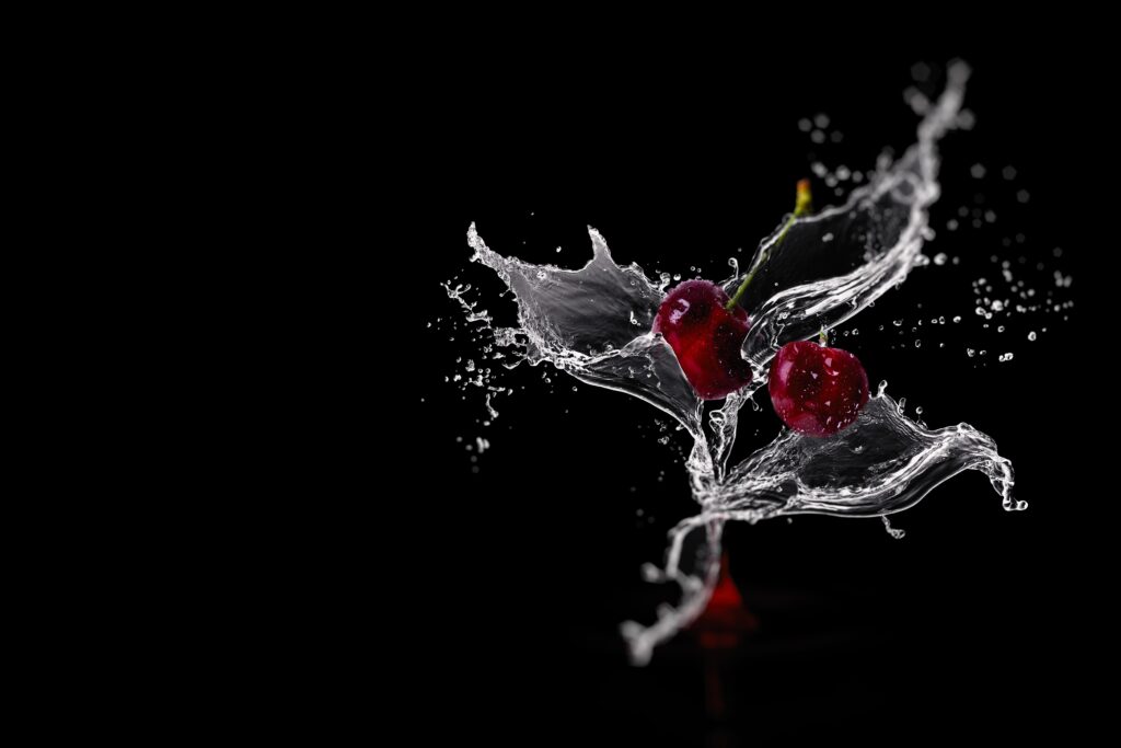 Vibrant Cherry Wallpaper: Water Droplets & Splash on Dark Background