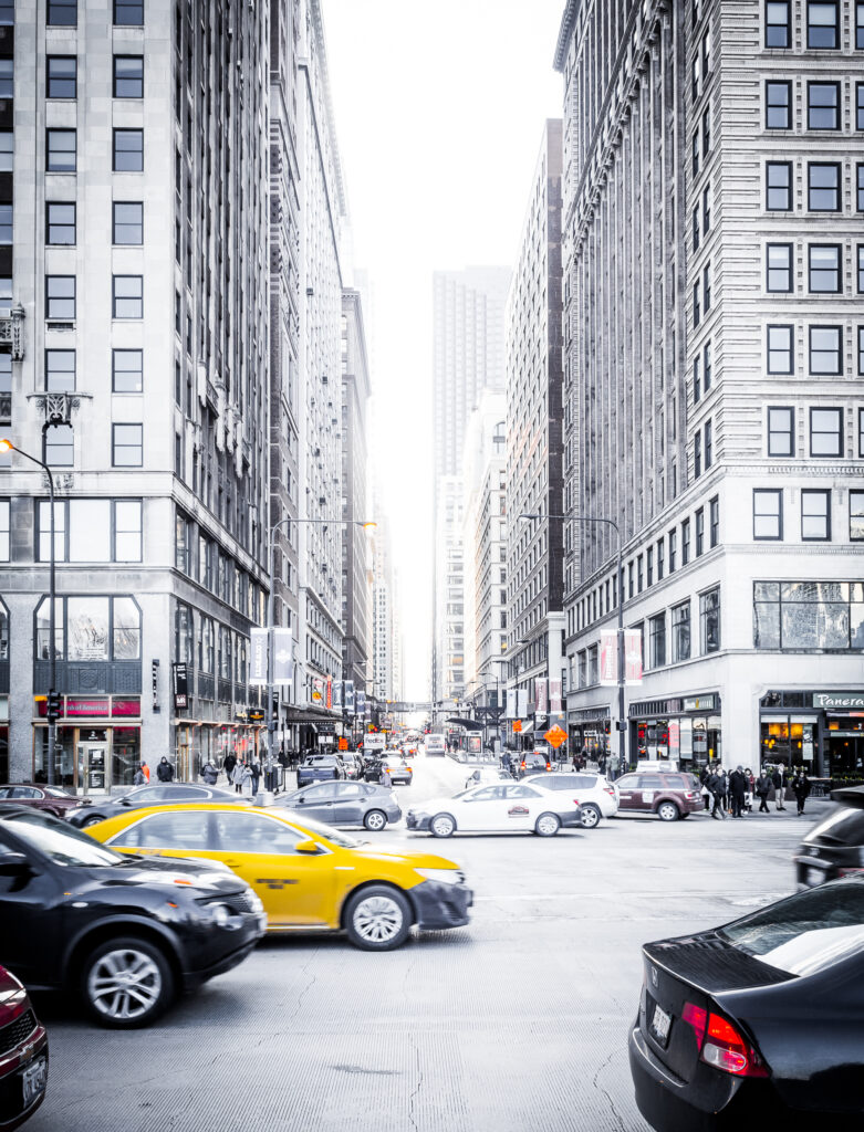 Vibrant Chicago City Street Wallpaper Background with Motion and Tall Buildings