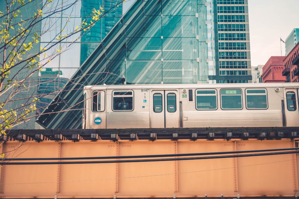 Vibrant Chicago Train Urban Wallpaper: Yellow Bridge & Glass Buildings