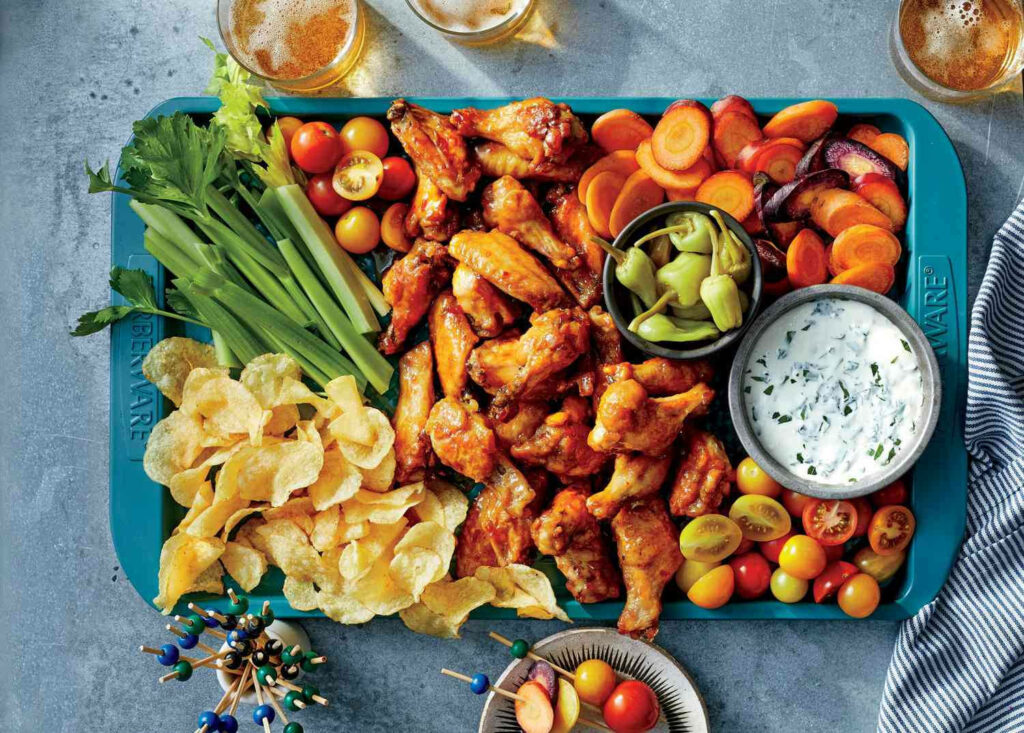 Delicious Chicken Wings & Veggies: Perfect Party Platter Wallpaper