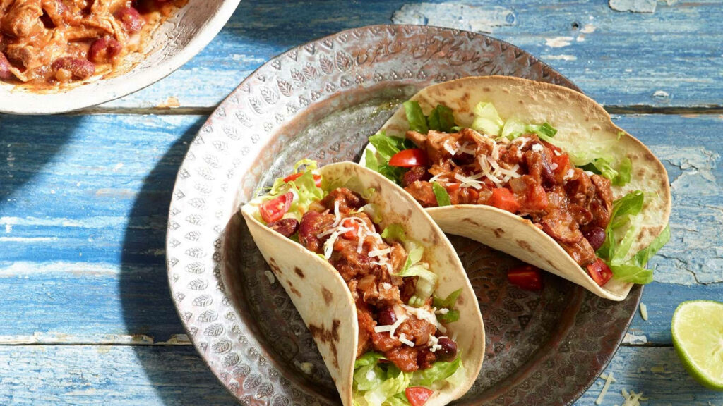 Vibrant Chili Con Carne Taco Wallpaper: Tantalizing Food Background