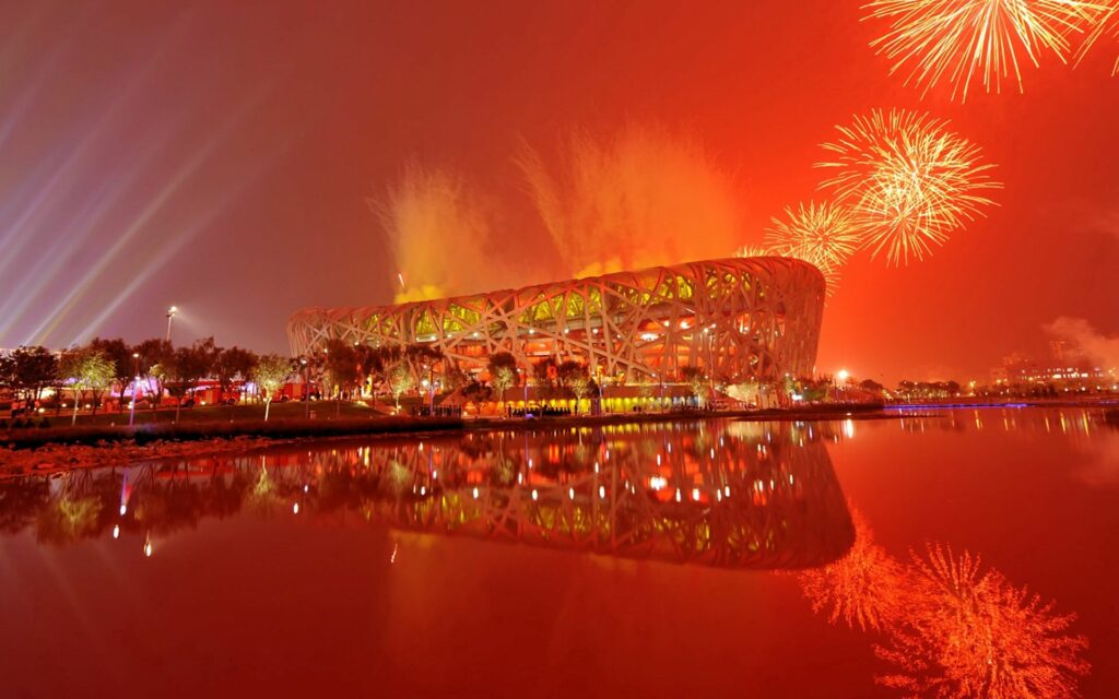 Vibrant Festival Wallpaper: Fireworks Over Iconic Chinese Architecture