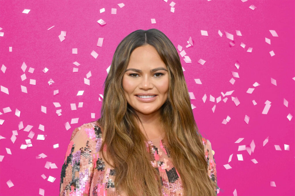 Chrissy Teigen Vibrant Wallpaper: Pink Backdrop & Cascading Confetti