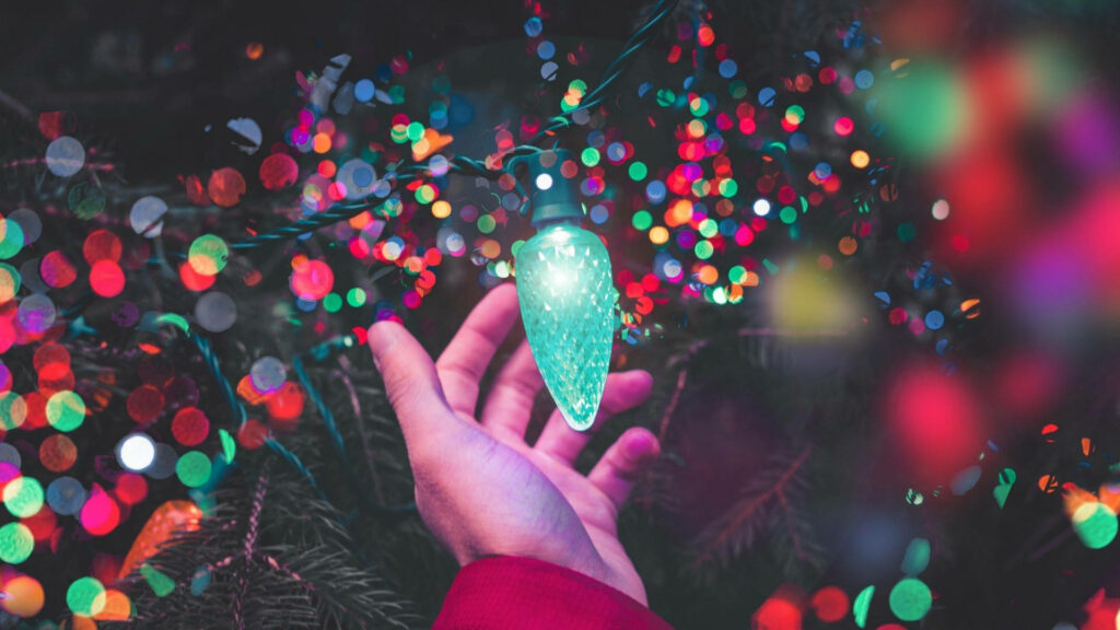 Festive Blue-Green Christmas Light Close-Up Desktop Wallpaper