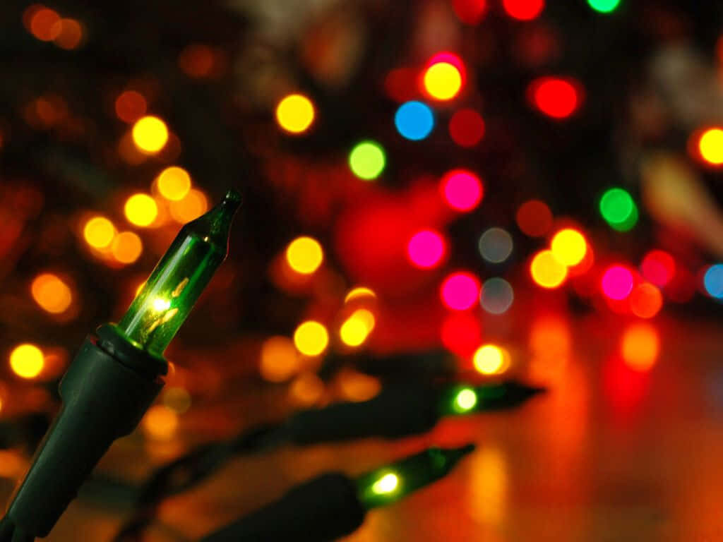 Vibrant Christmas Night: Glowing Lights Illuminate Winter Sky Wallpaper