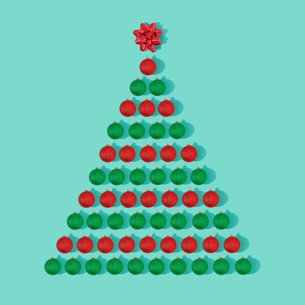 Festive Christmas Tree Wallpaper: Red & Green Balls on Turquoise Background
