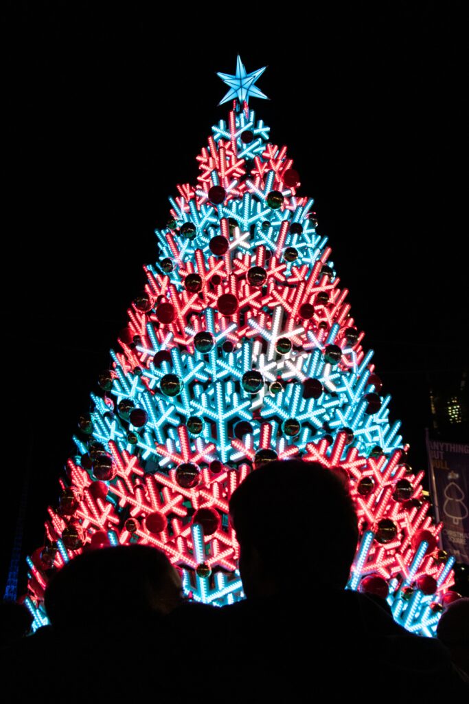 Vibrant Christmas Tree Wallpaper with Blue & Red Lights | New Year Background