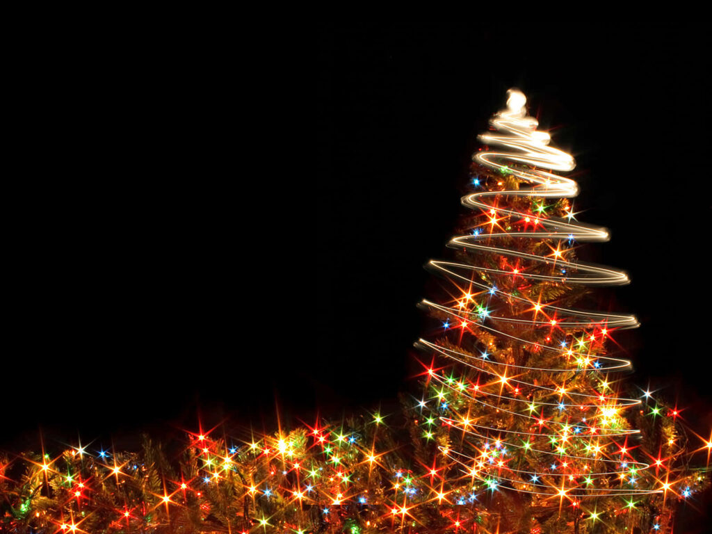 Vibrant Christmas Tree Wallpaper with Multicolored Lights on Black
