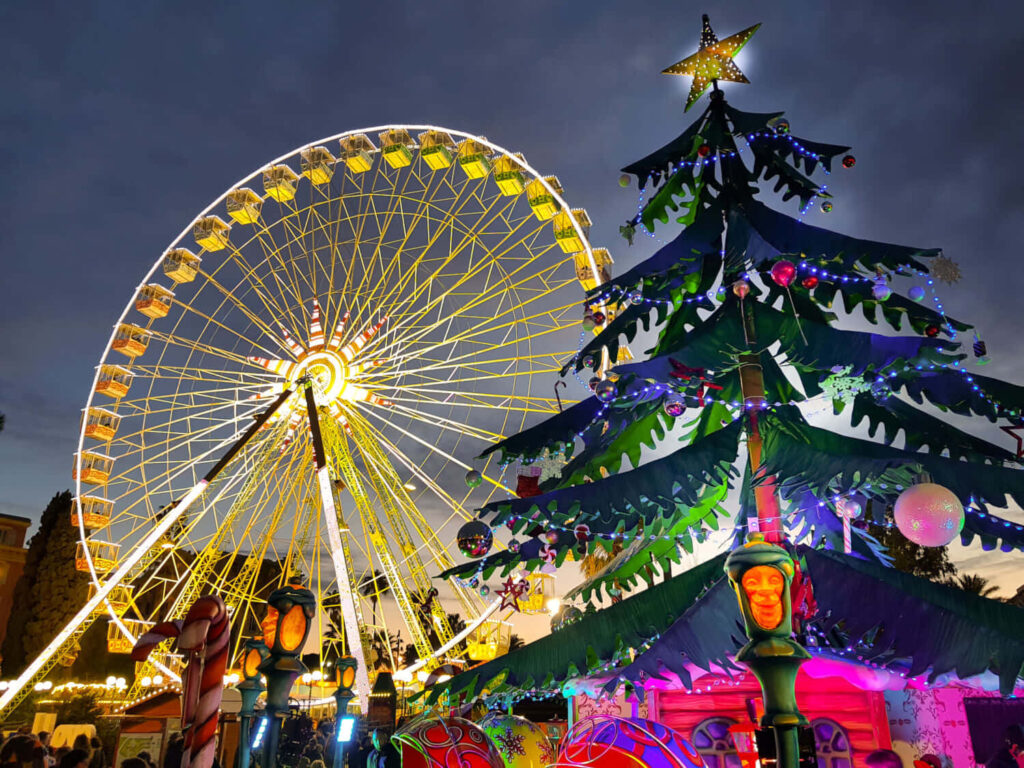 Vibrant Christmas Scene: Ferris Wheel & Decorated Tree Background Wallpaper