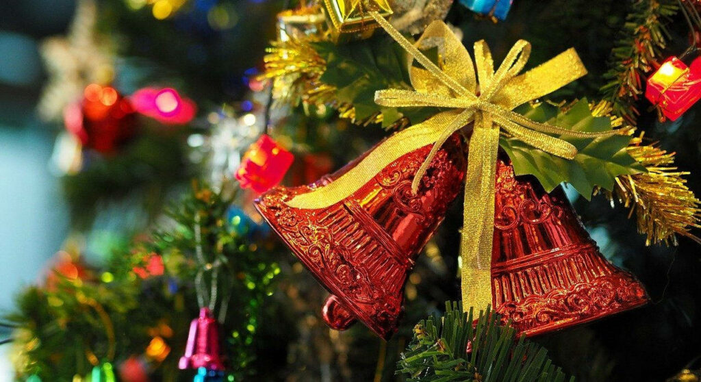 Festive Christmas Wallpaper: Red Bells & Pine Branches Decor