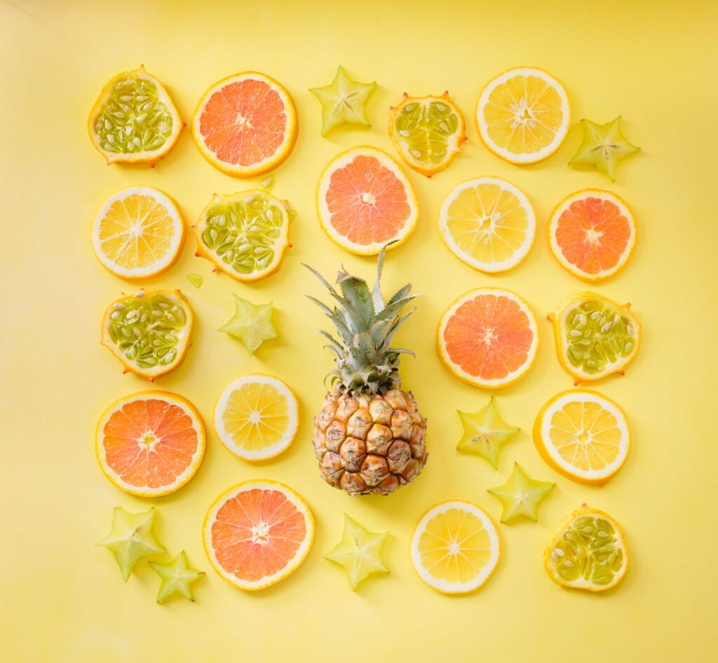 Vibrant Citrus Fruits Wallpaper: Orange, Lemon, Pineapple Design