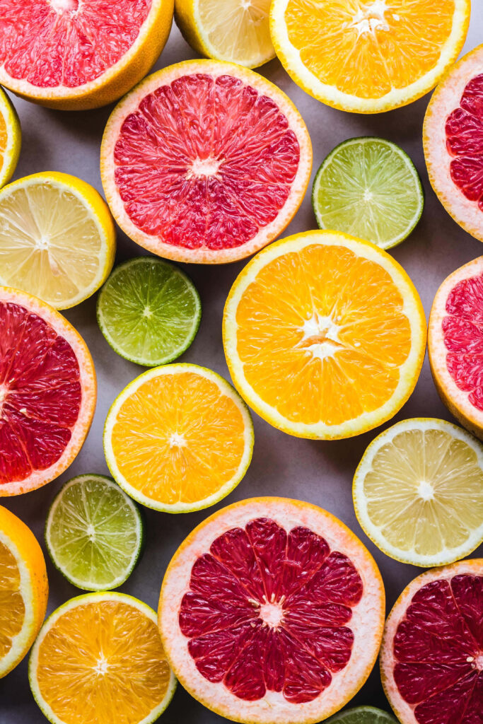 Vibrant Citrus Fruits iPhone Wallpaper: Fresh & Playful Background