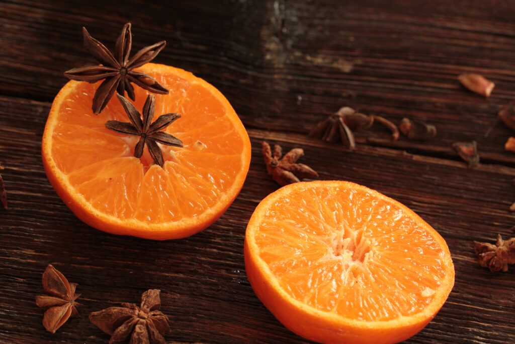 Vibrant Citrus & Spice Wallpaper: Fresh Oranges & Star Anise