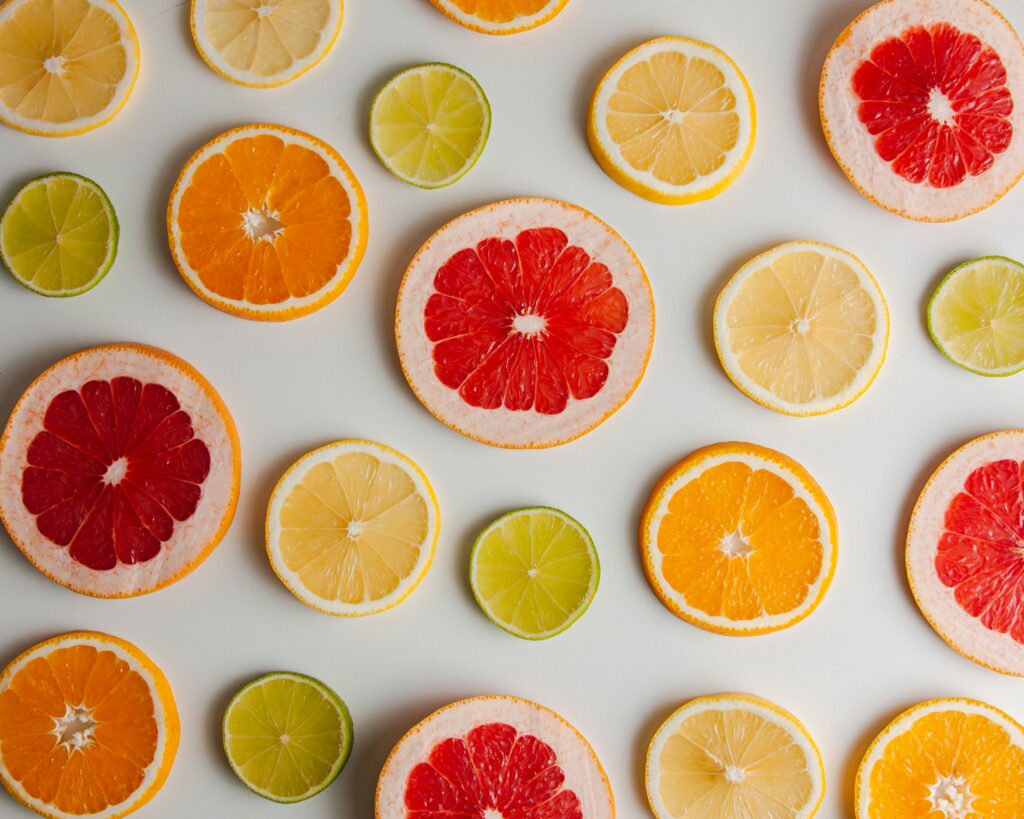 Colorful Citrus Slice Wallpaper Background: Grapefruit, Orange, Lemon, Lime
