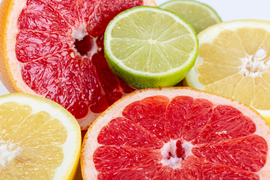 Vibrant Citrus Fruit Wallpaper: Lime, Grapefruit & Colorful Background