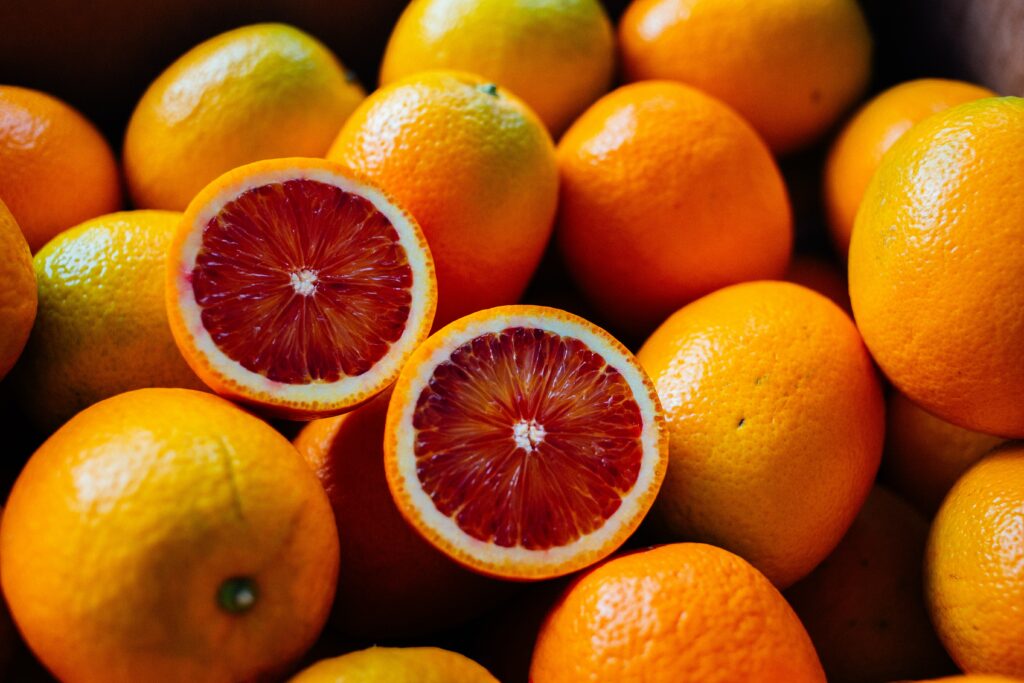 Colorful Citrus Wallpaper: Fresh Oranges & Sliced Red Orange Delight