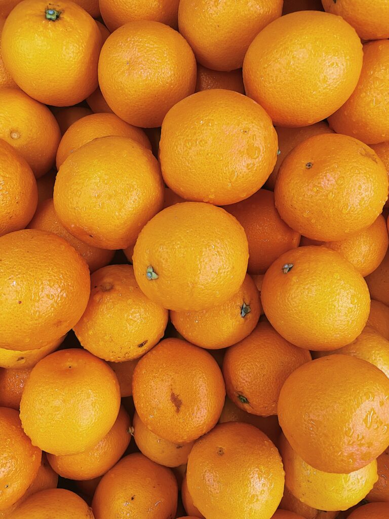 Vibrant Citrus Wallpaper: Fresh Wet Oranges in Bright Color