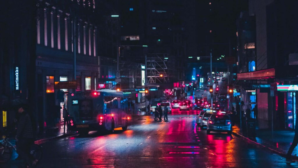 Neon Nights: Vibrant City Street Wallpaper Background