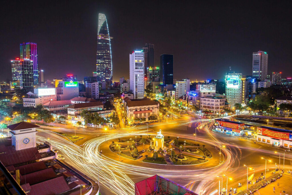Vibrant City Skyline at Night: Colorful Lighting Wallpaper Background