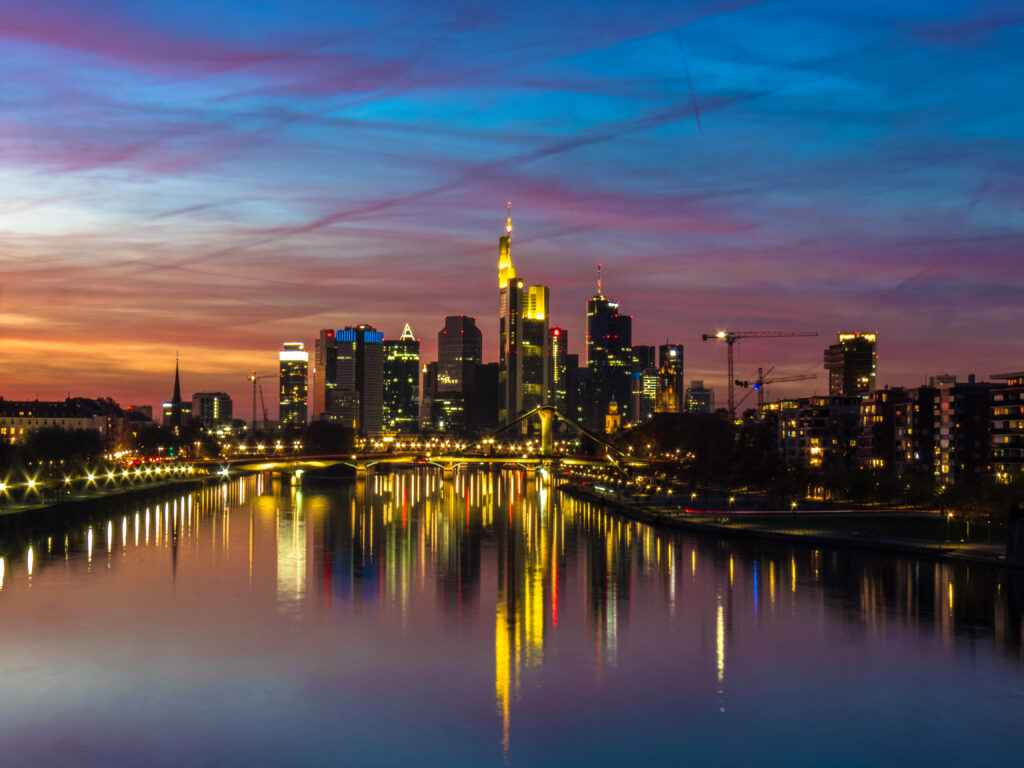 Vibrant City Skyline Twilight Wallpaper: Illuminated Reflections