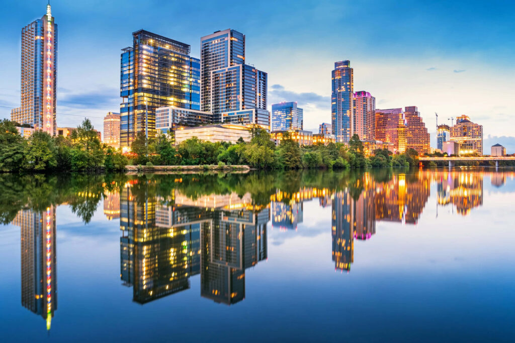 Vibrant City Skyline Wallpaper: Serene Evening Reflections