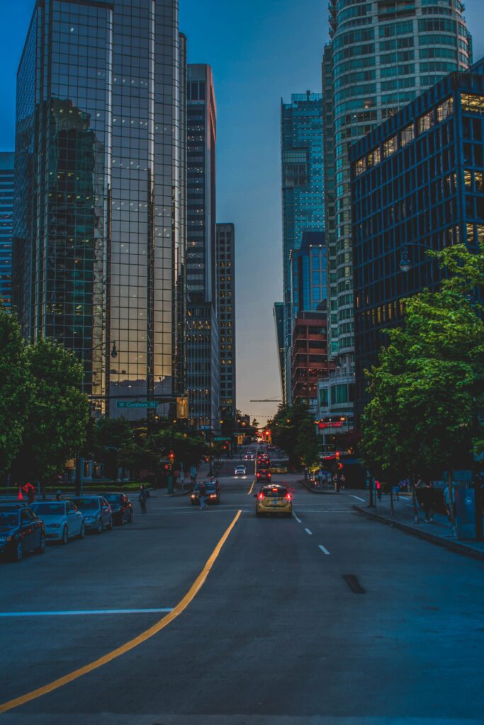 Vibrant Evening City Street Wallpaper with Modern Architecture