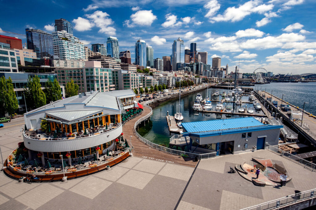 Vibrant Cityscape Aerial View: Modern Architecture & Serene Waterfront Wallpaper