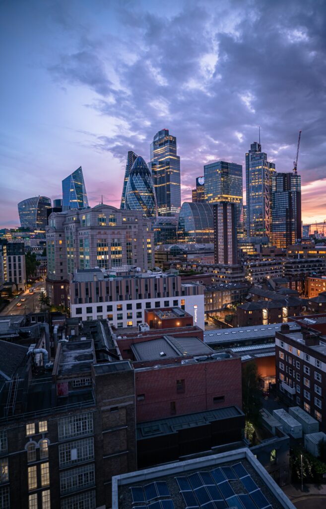 Vibrant Cityscape Wallpaper: Evening Architecture & Gradient Sky