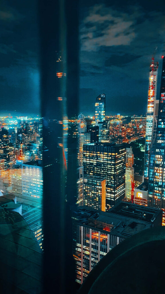 Vibrant Night Cityscape Wallpaper: Illuminated Skyscrapers View
