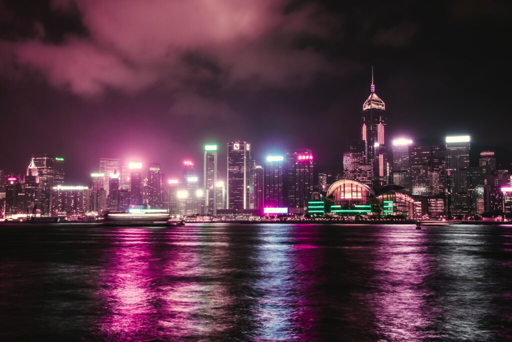 Vibrant Night Cityscape Wallpaper: Neon Lights & Skyscrapers