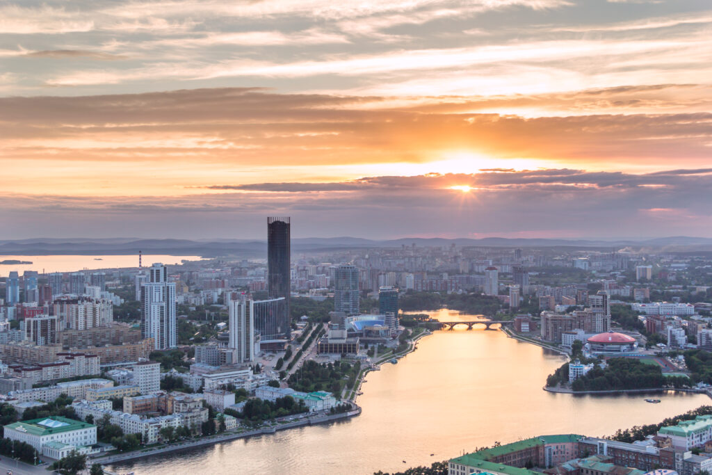 Vibrant Cityscape Sunset Wallpaper - Serene Urban Background
