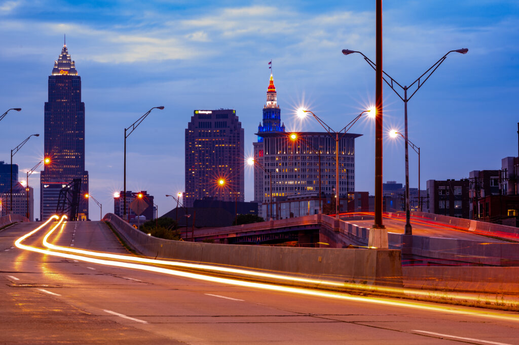 Vibrant Twilight Cityscape Wallpaper: Glowing Lights & Towering Buildings