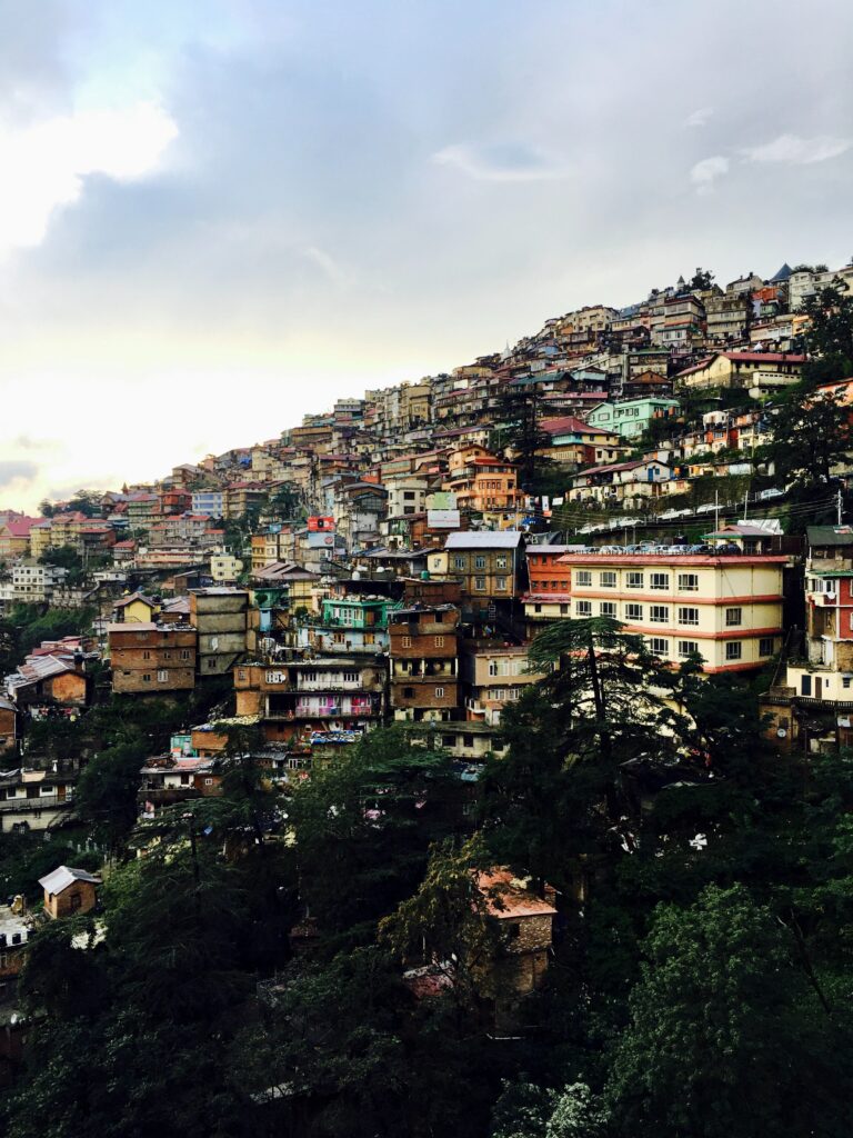Vibrant Cityscape Wallpaper: Colorful Hillside Architecture Background