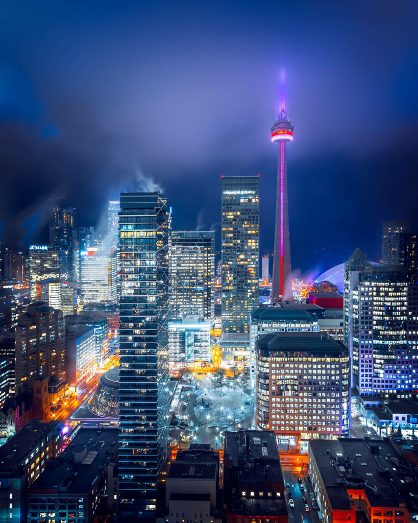 Vibrant Cityscape Night Wallpaper: Colorful Lights & Towering Skyscrapers