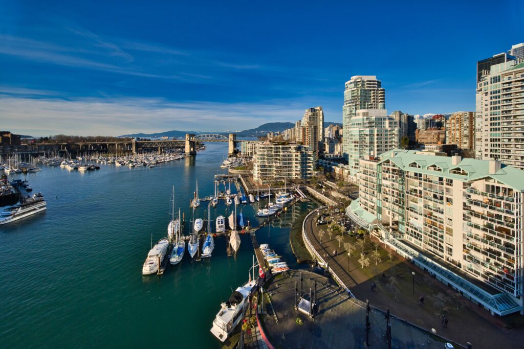 Vibrant Cityscape Wallpaper: Modern Buildings & Scenic Marina Reflections