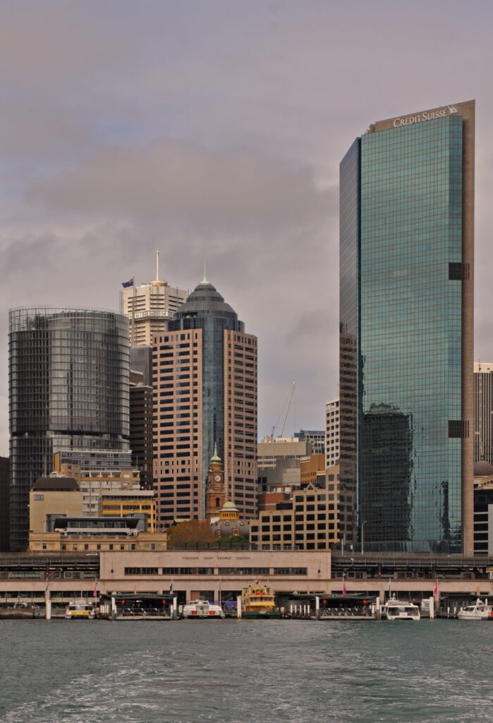 Vibrant Cityscape Wallpaper: Modern High-Rises & Serene Waters