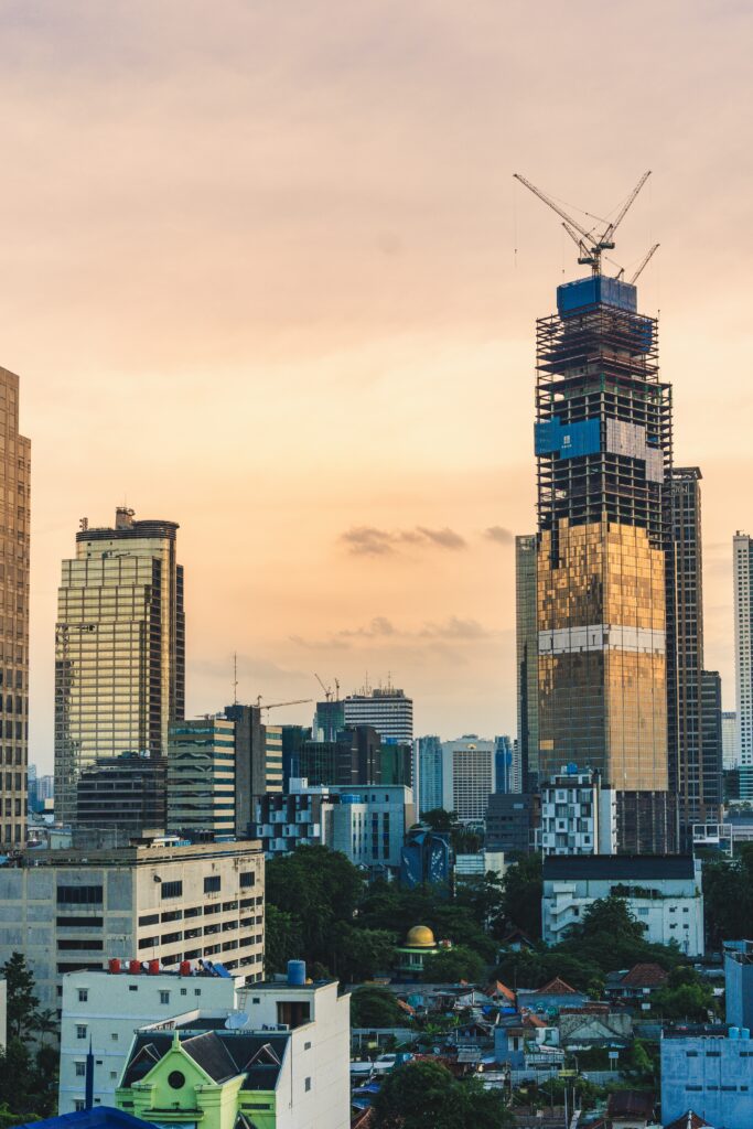 Vibrant Cityscape Wallpaper: Modern Skyscrapers & Evening Sky