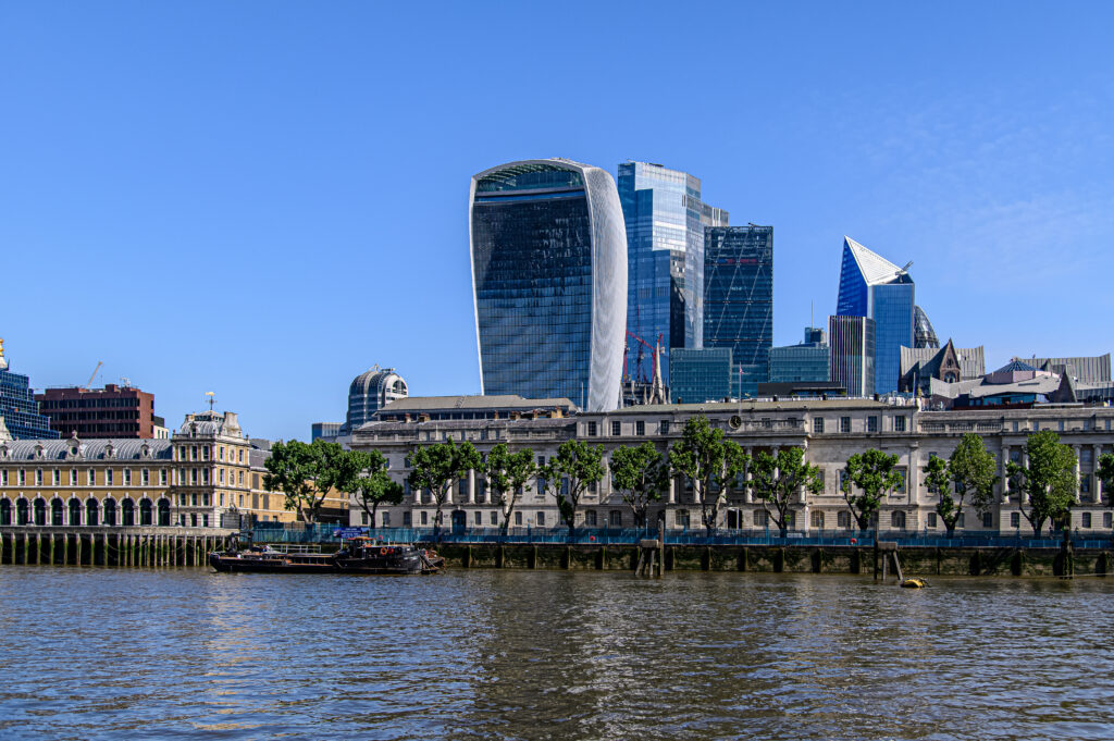 Vibrant Cityscape Wallpaper: Modern Architecture & Scenic Riverside