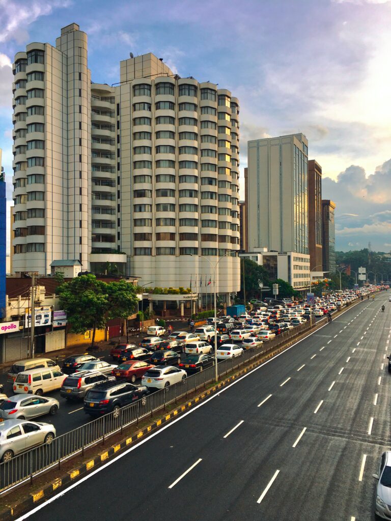 Vibrant Cityscape Wallpaper: Modern Buildings & Rush Hour Energy
