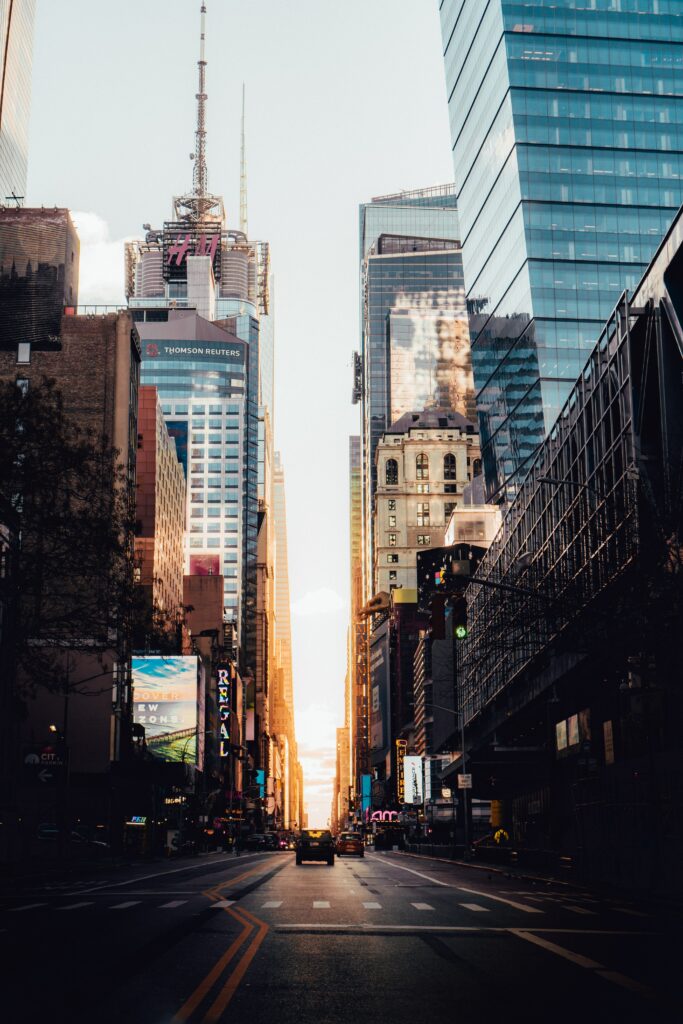 Vibrant Cityscape Wallpaper: Towering Buildings & Sunset Glow