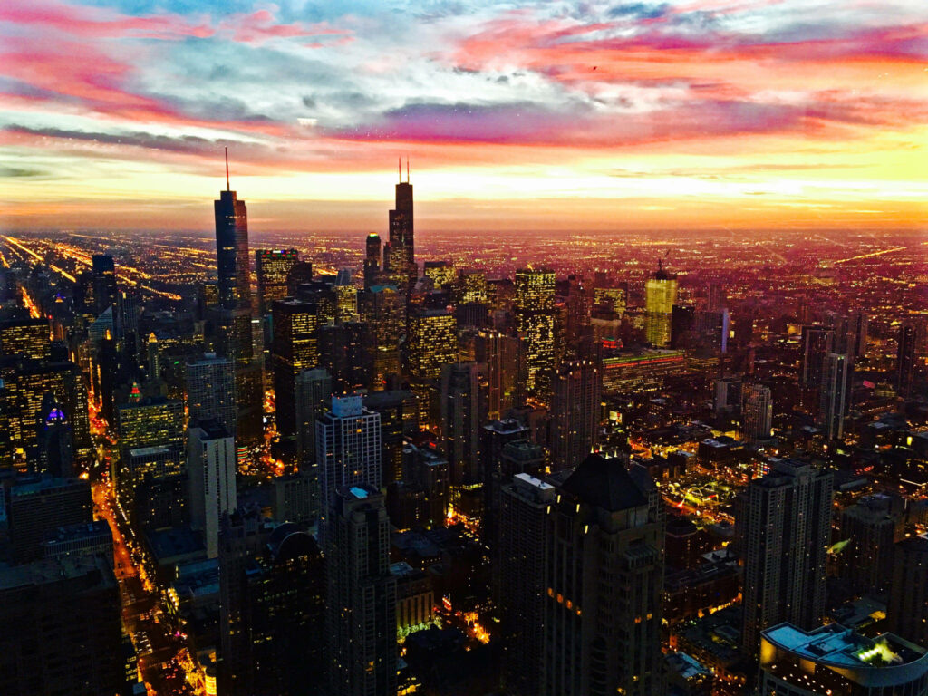 Vibrant Cityscape Wallpaper: Skyscrapers at Sunset with Stunning Hues