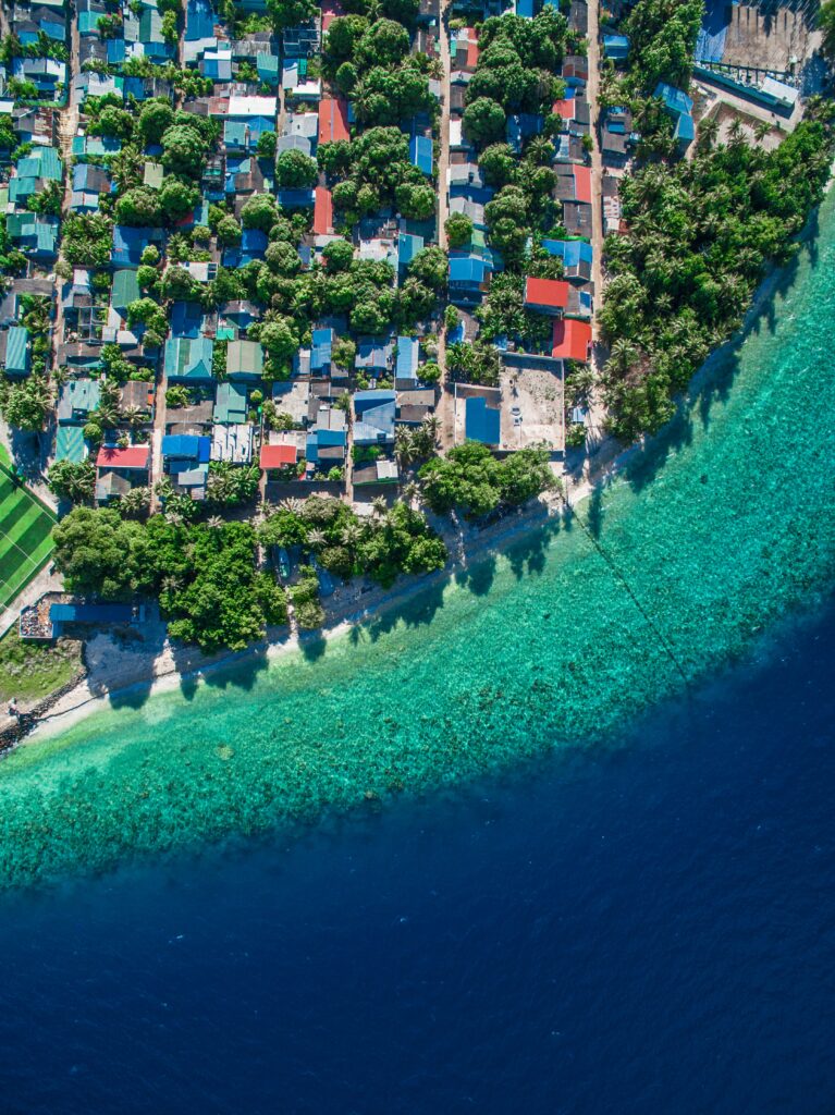Coastal City Aerial Wallpaper: Vibrant Colors & Turquoise Waters