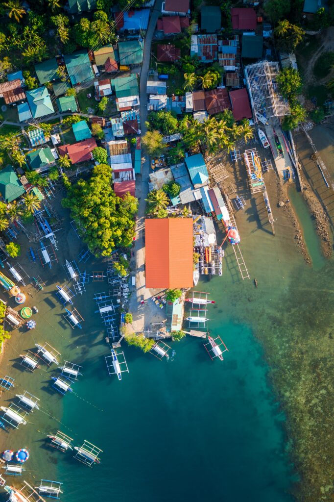 Vibrant Coastal City Wallpaper: Aerial View of Colorful Rooftops