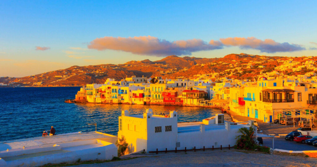 Vibrant Coastal Cityscape Wallpaper: Colorful Buildings & Sunset Views