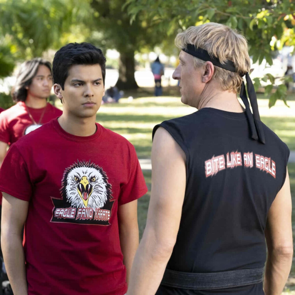 Cobra Kai Wallpaper: Vibrant Art of Eagle Fang vs. Cobra Kai Rivalry