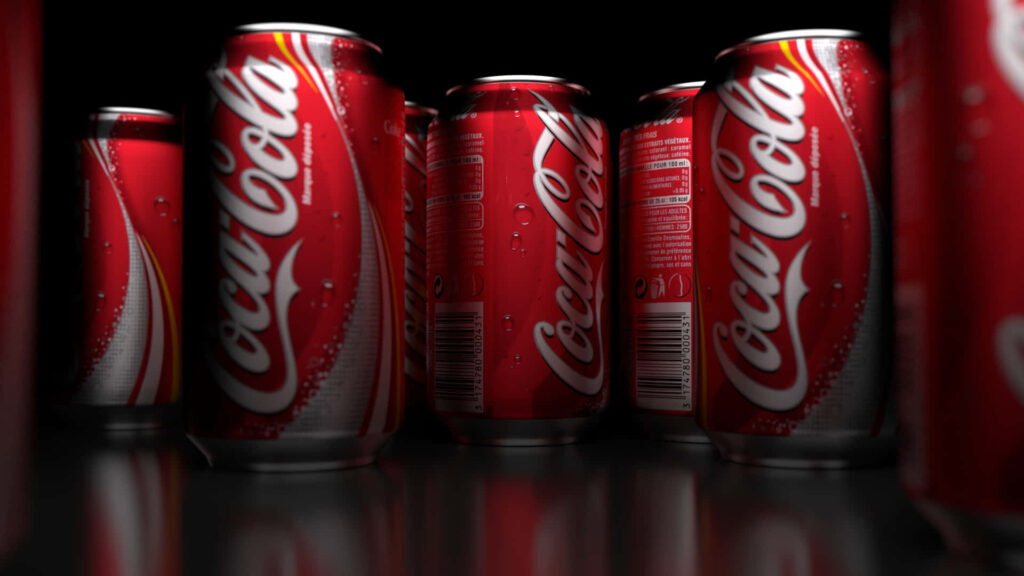 Vibrant Coca-Cola wallpaper with red cans glossy condensation and dramatic lighting background