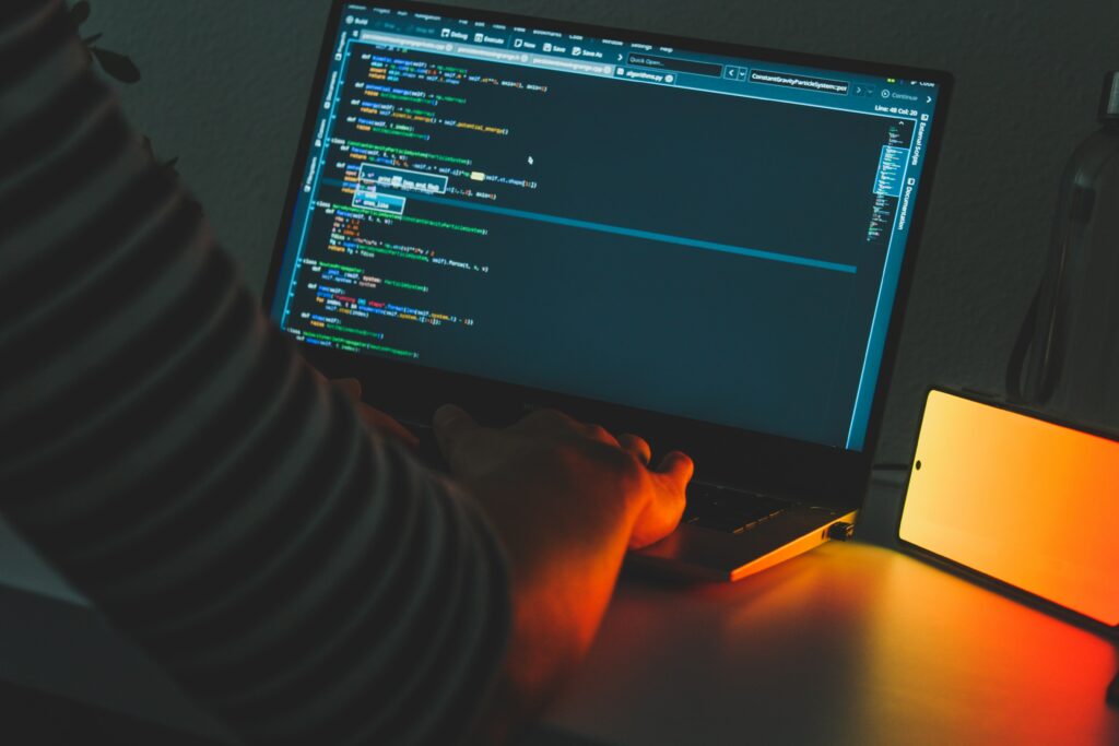 Vibrant Programmer Wallpaper: Focused Tech Atmosphere & Code