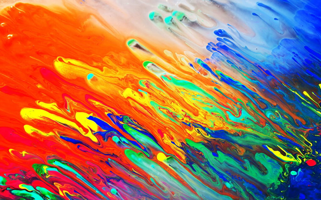 Vibrant abstract fluid paint texture wallpaper with swirling orange yellow green blue diagonal streaks